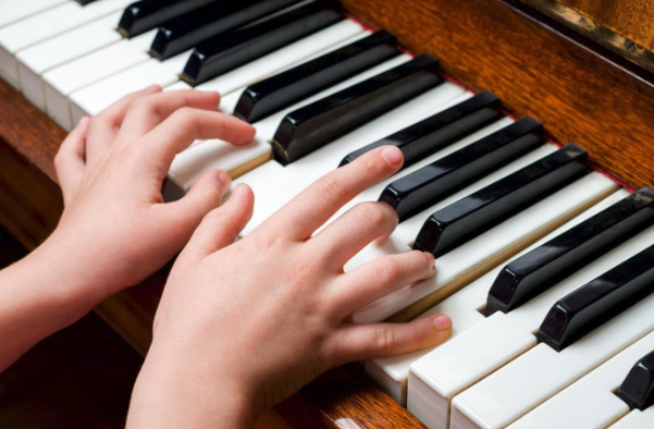 piano with hands playing